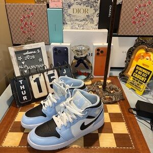 Nike Air Jordan 1 Mid in the 'Ice Blue/Black-Sail-White' colorway